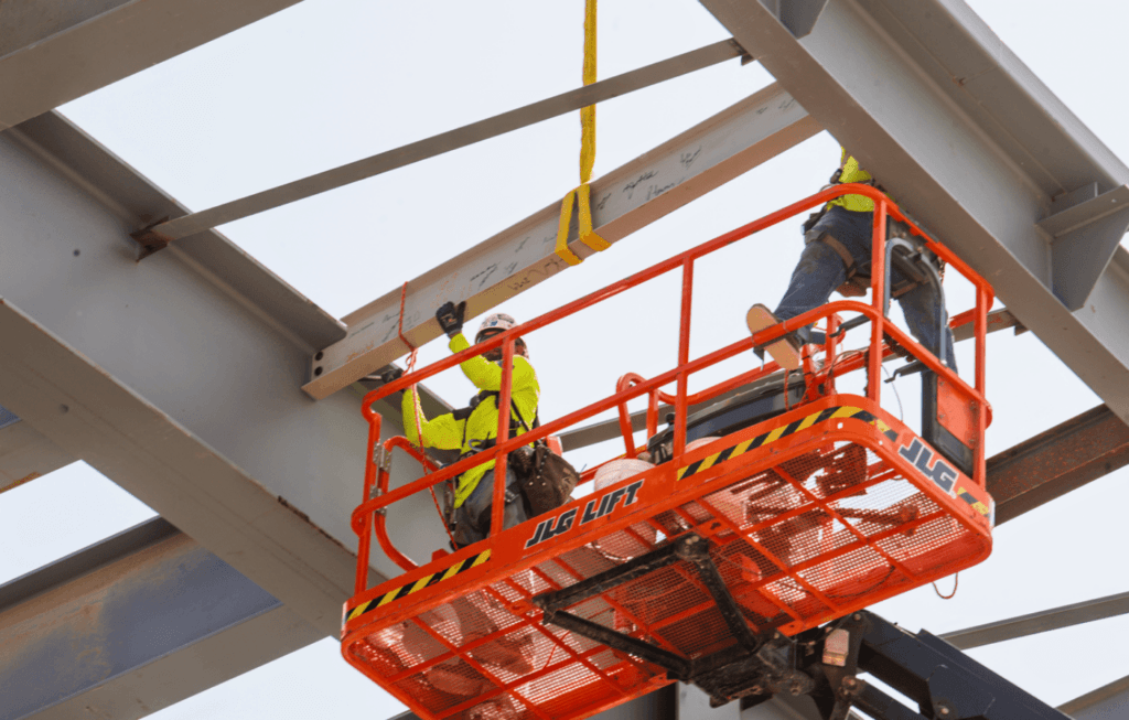 Crossland team members install the beam.