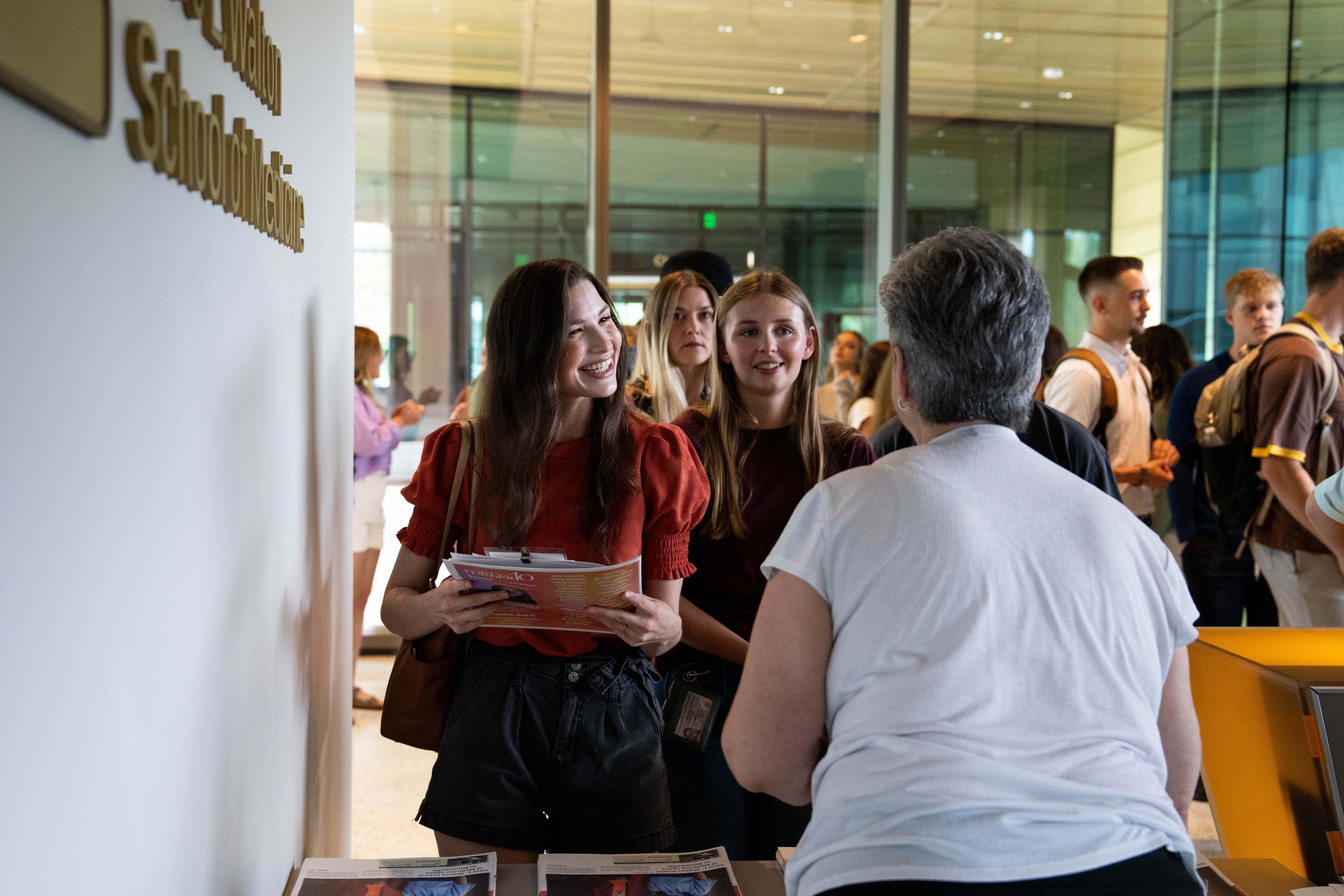 AWSOM student being welcomed at front desk