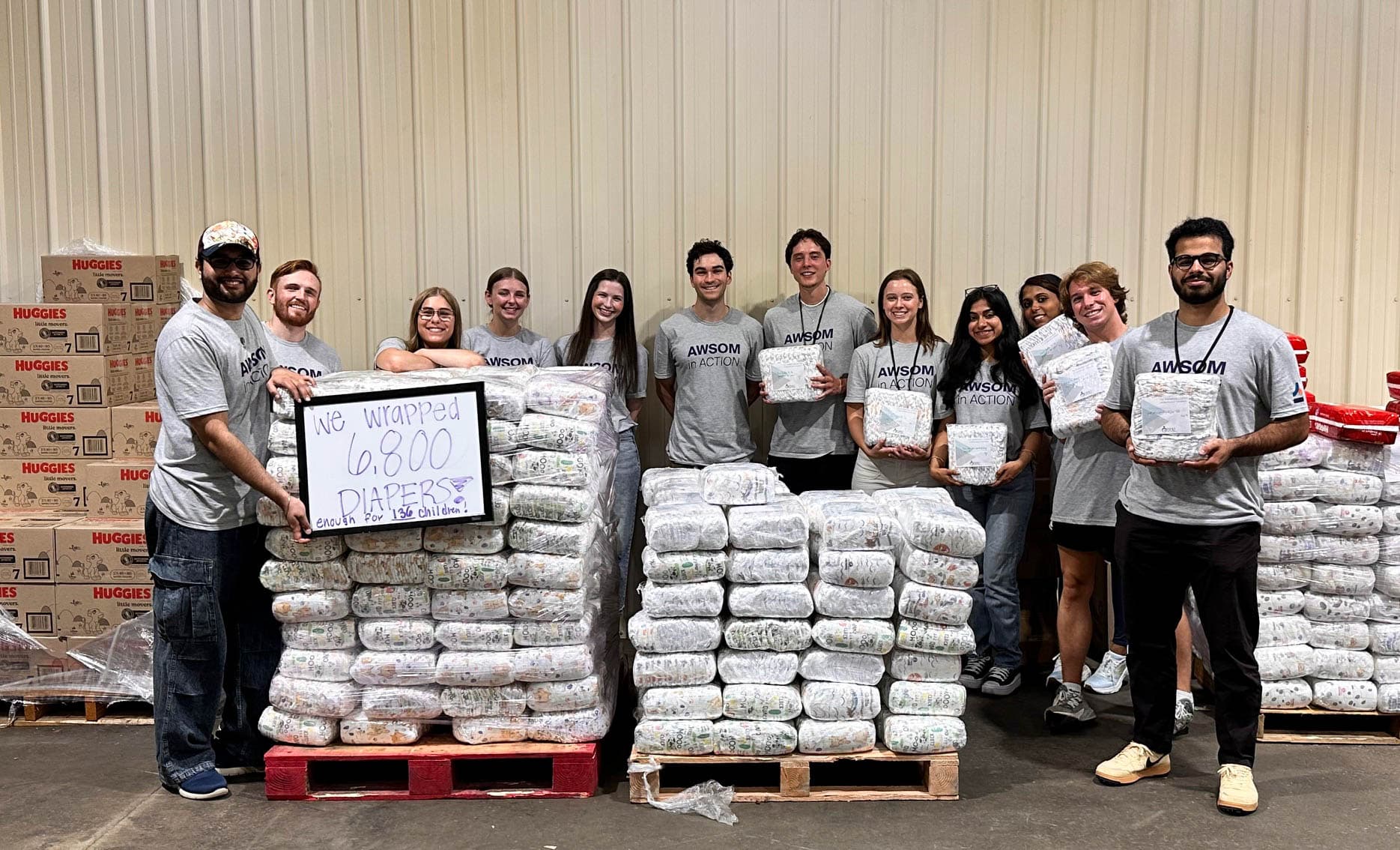 AWSOM students during the 2025 Day of Service with diapers wrapped for Family Network NWA