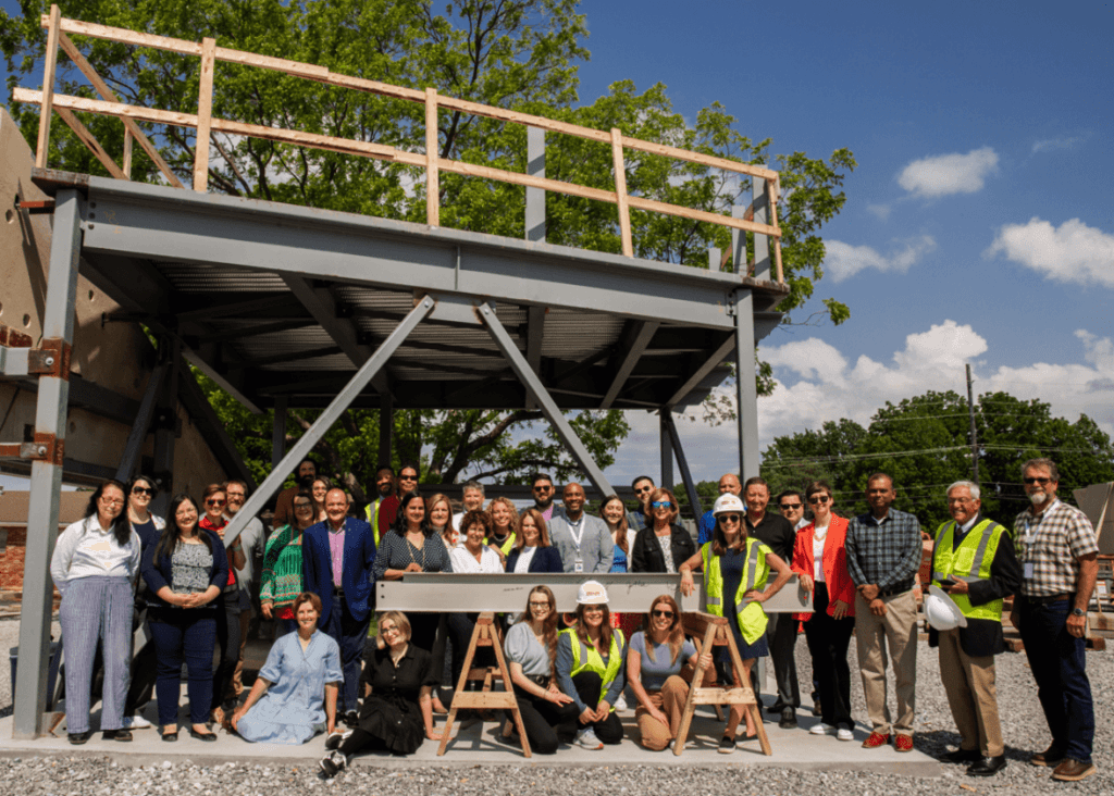 AWSOM team members pose with the beam.