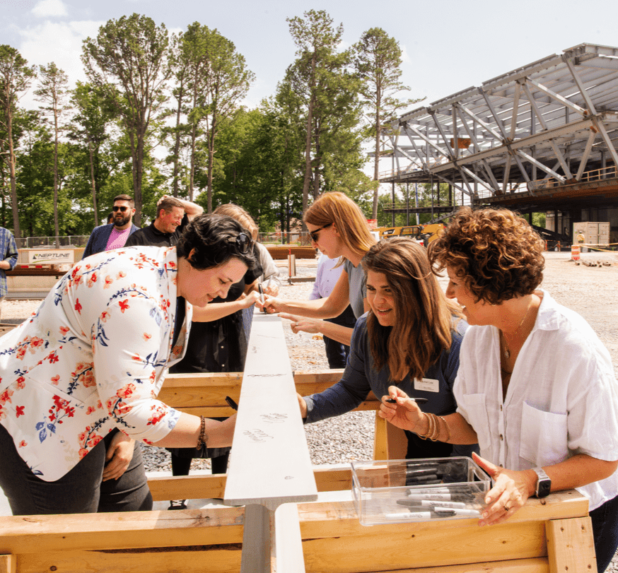 Staff signing the final steal beam