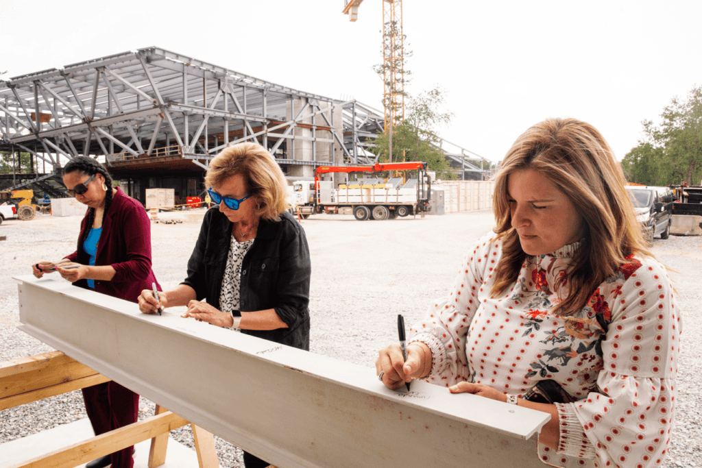 Staff signing the final steal beam