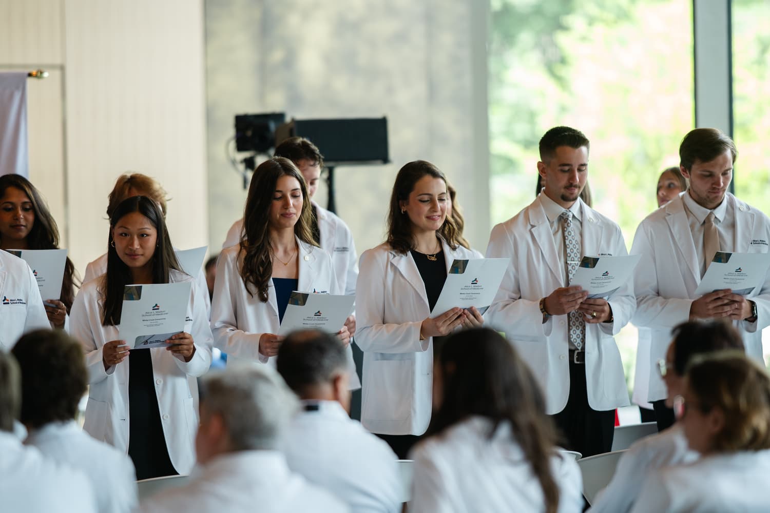 Students at white coat ceremony