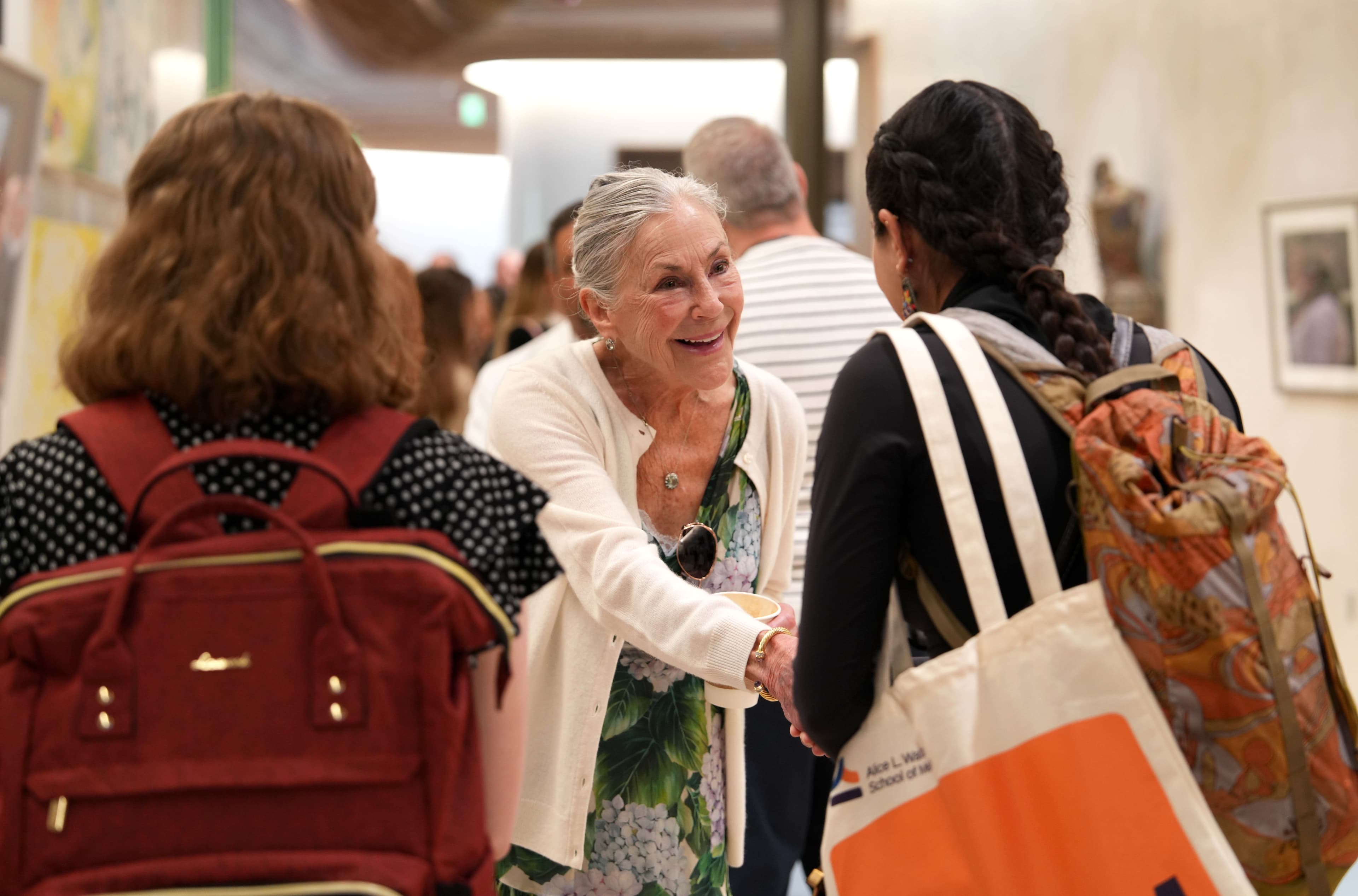 Alice Walton greeting student