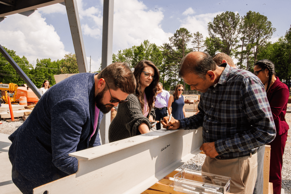 Staff signing the final steal beam